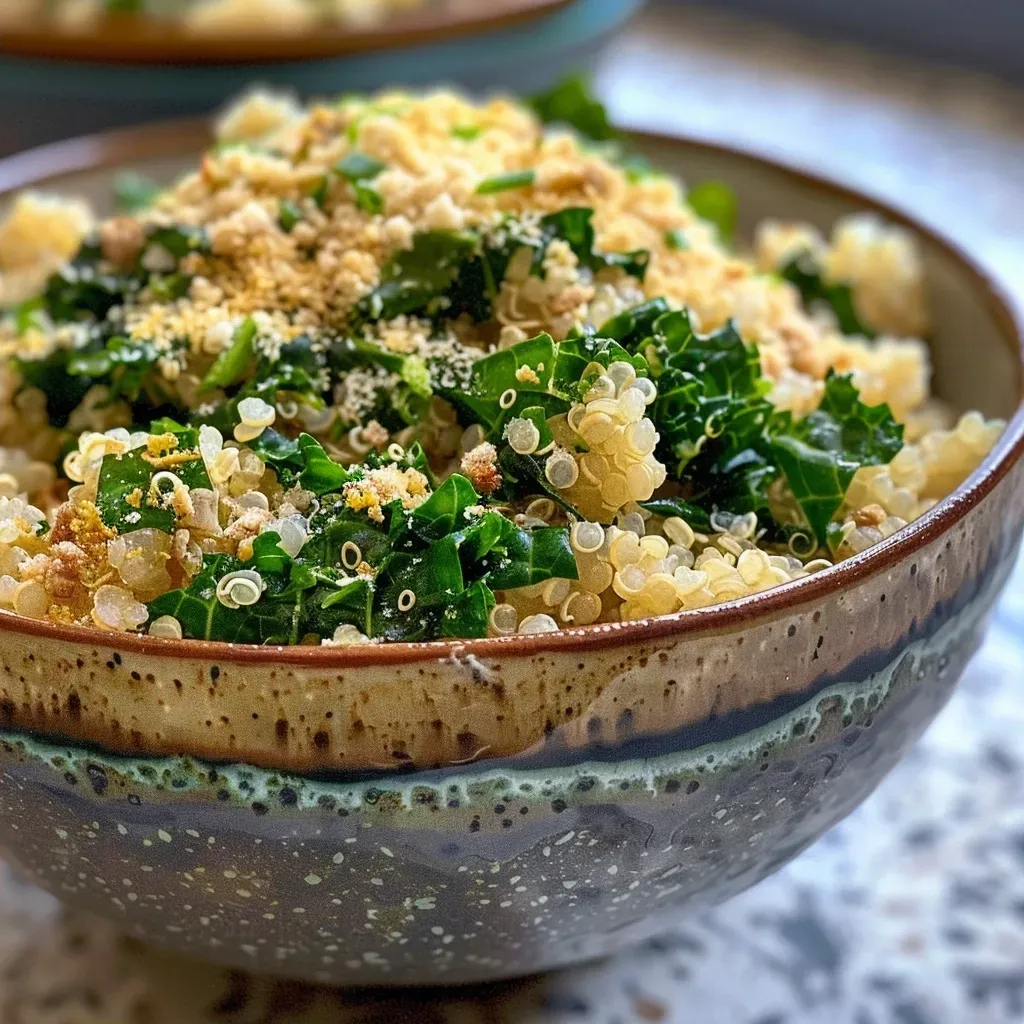 ['A close-up view of a creamy cheesy quinoa bowl with kale and toppings.', 'A vibrant quinoa bowl featuring a creamy cheese sauce and fresh greens.', 'A side view of a delicious quinoa dish showcasing its creamy texture and colorful ingredients.', 'A rich quinoa bowl filled with cheese, spices, and chopped kale, captured with an iPhone.']