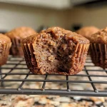 Close-up of gingerbread protein muffins showing a moist texture and spice toppings.
