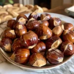 Close-up of roasted chestnuts showcasing their golden-brown shells.