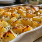 Close-up shot of a creamy rutabaga casserole with a golden-brown top.