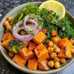 Close-up view of a colorful Sweet Potato Chickpea Buddha Bowl with vibrant ingredients.